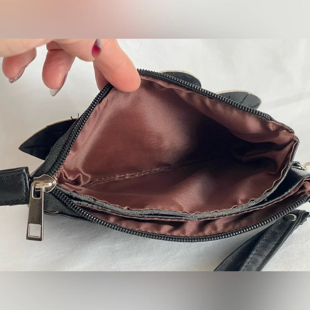Fun little black faux, leather clutch wristlet three pocket with a zipper
